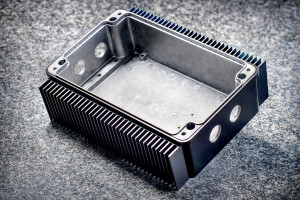 We have customized this standard ROLEC enclosure with holes and combined it with extruded heatsinks. It has also been powder-coated.